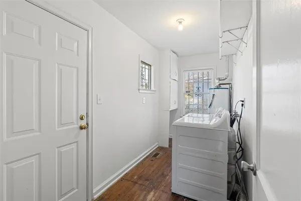 a room that has a dresser in it