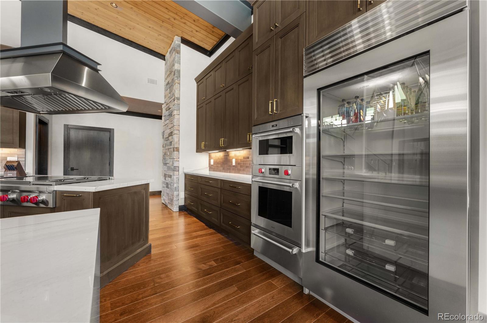 21261 Broadview Road Nathrop, CO 81236 - Photo 14 of 49 a kitchen with stainless steel appliances a stove top oven and cabinets