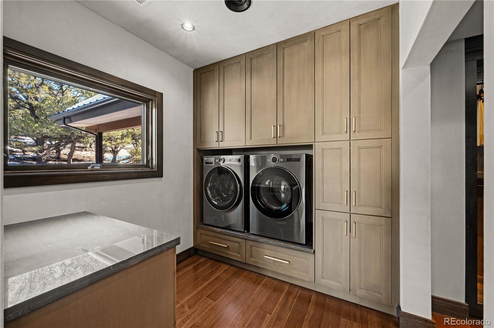 21261 Broadview Road Nathrop, CO 81236 - Photo 26 of 49 a utility room with stainless steel appliances granite countertop a washer and dryer