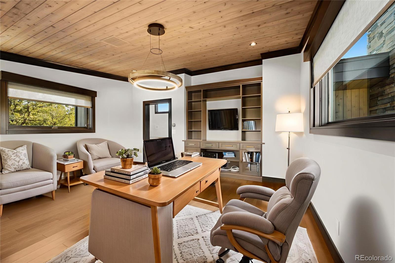 21261 Broadview Road Nathrop, CO 81236 - Photo 30 of 49 a work room with furniture wooden floor and windows