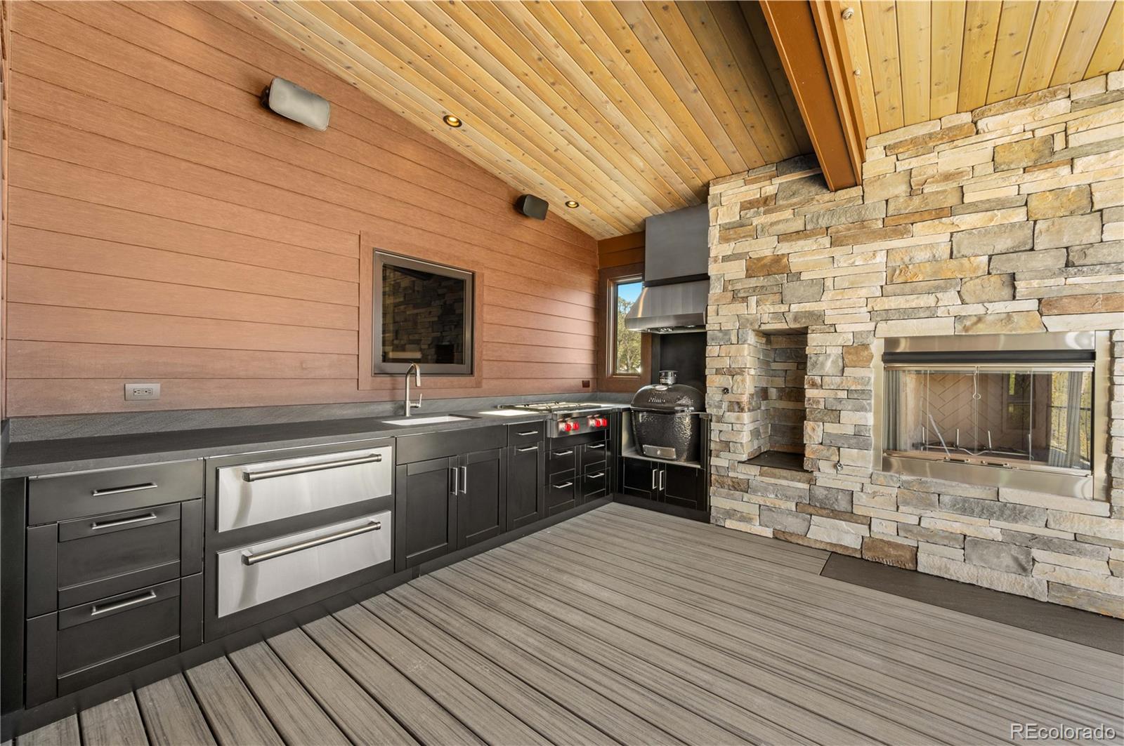 21261 Broadview Road Nathrop, CO 81236 - Photo 33 of 49 a kitchen with stainless steel appliances wooden cabinets a sink and a stove