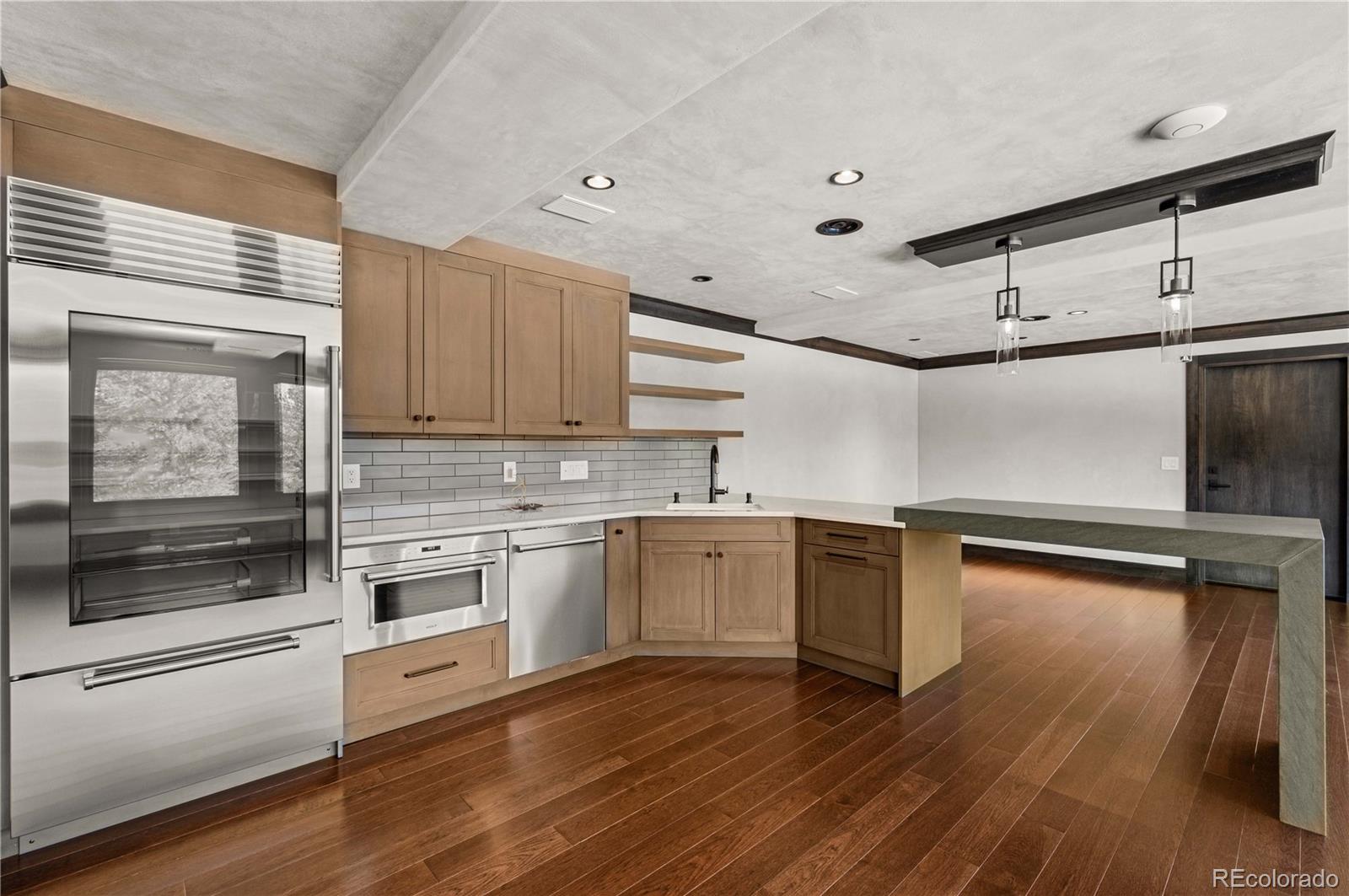 21261 Broadview Road Nathrop, CO 81236 - Photo 36 of 49 a kitchen with a refrigerator and a stove top oven