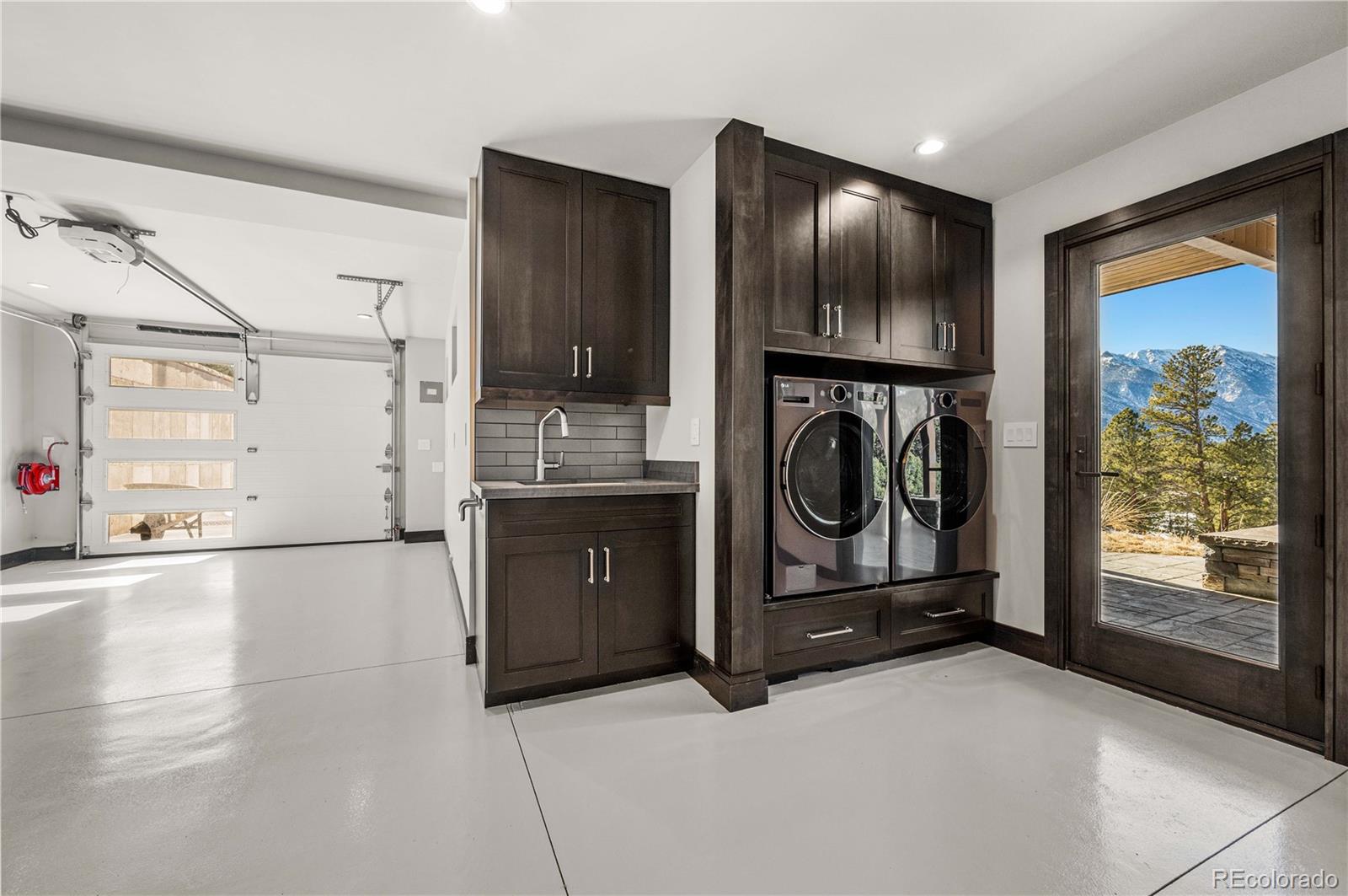 21261 Broadview Road Nathrop, CO 81236 - Photo 42 of 49 a view of a storage & utility room with washer and dryer