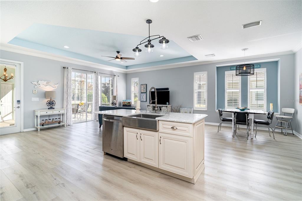 302 Latitude Place Apollo Beach, FL 33572 - Photo 13 of 50 a large white kitchen with lots of counter space a sink and appliances