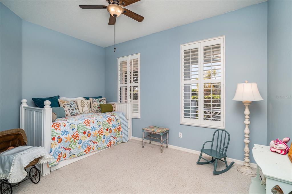 302 Latitude Place Apollo Beach, FL 33572 - Photo 20 of 50 a bedroom with bed and a window