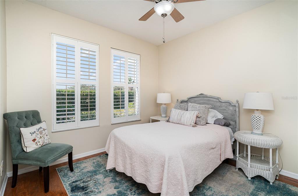 302 Latitude Place Apollo Beach, FL 33572 - Photo 22 of 50 a bedroom with a bed a table and chair