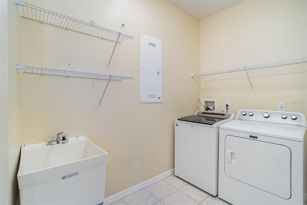 302 Latitude Place Apollo Beach, FL 33572 - Photo 26 of 50 a utility room with dryer and washer
