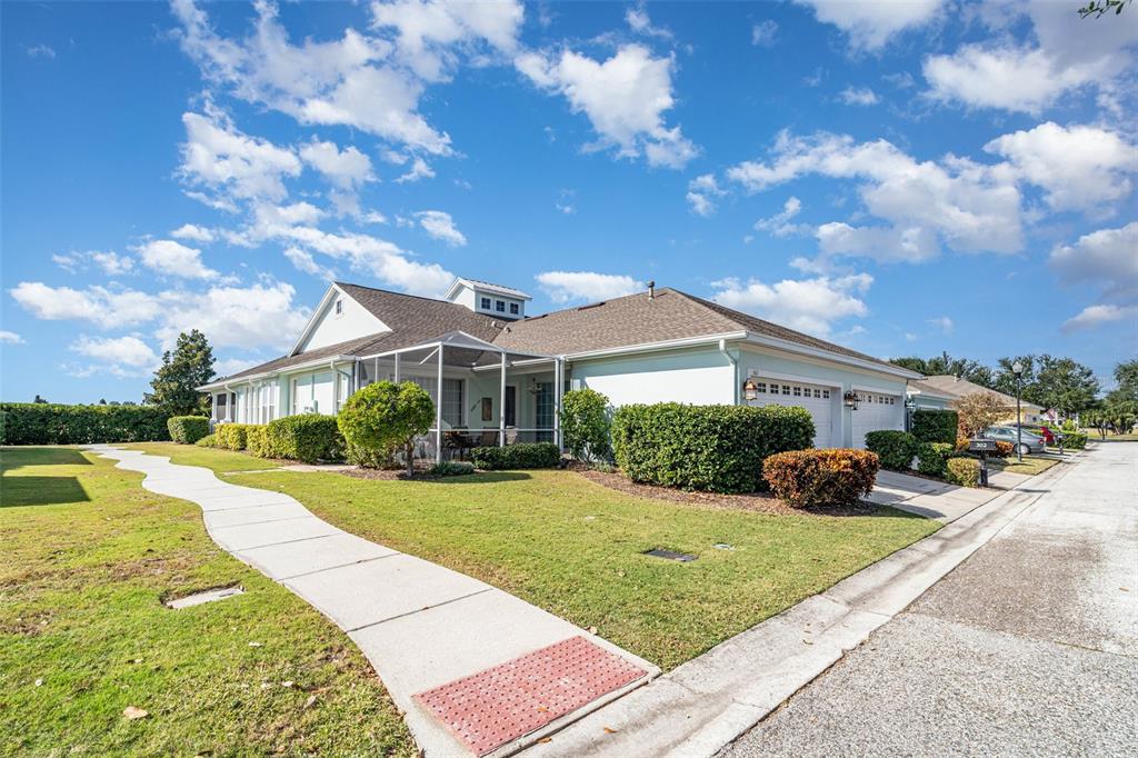 302 Latitude Place Apollo Beach, FL 33572 - Photo 31 of 50 a front view of a house with yard slide and outdoor seating