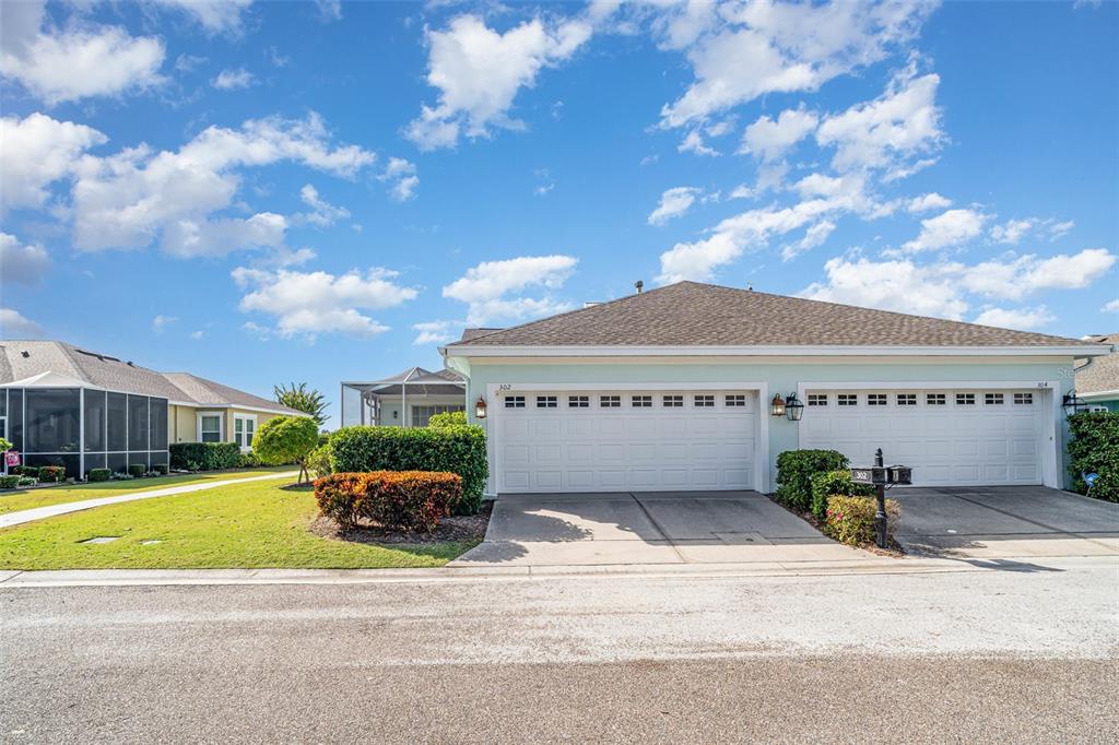 302 Latitude Place Apollo Beach, FL 33572 - Photo 32 of 50 a view of a house with a swimming pool and a yard