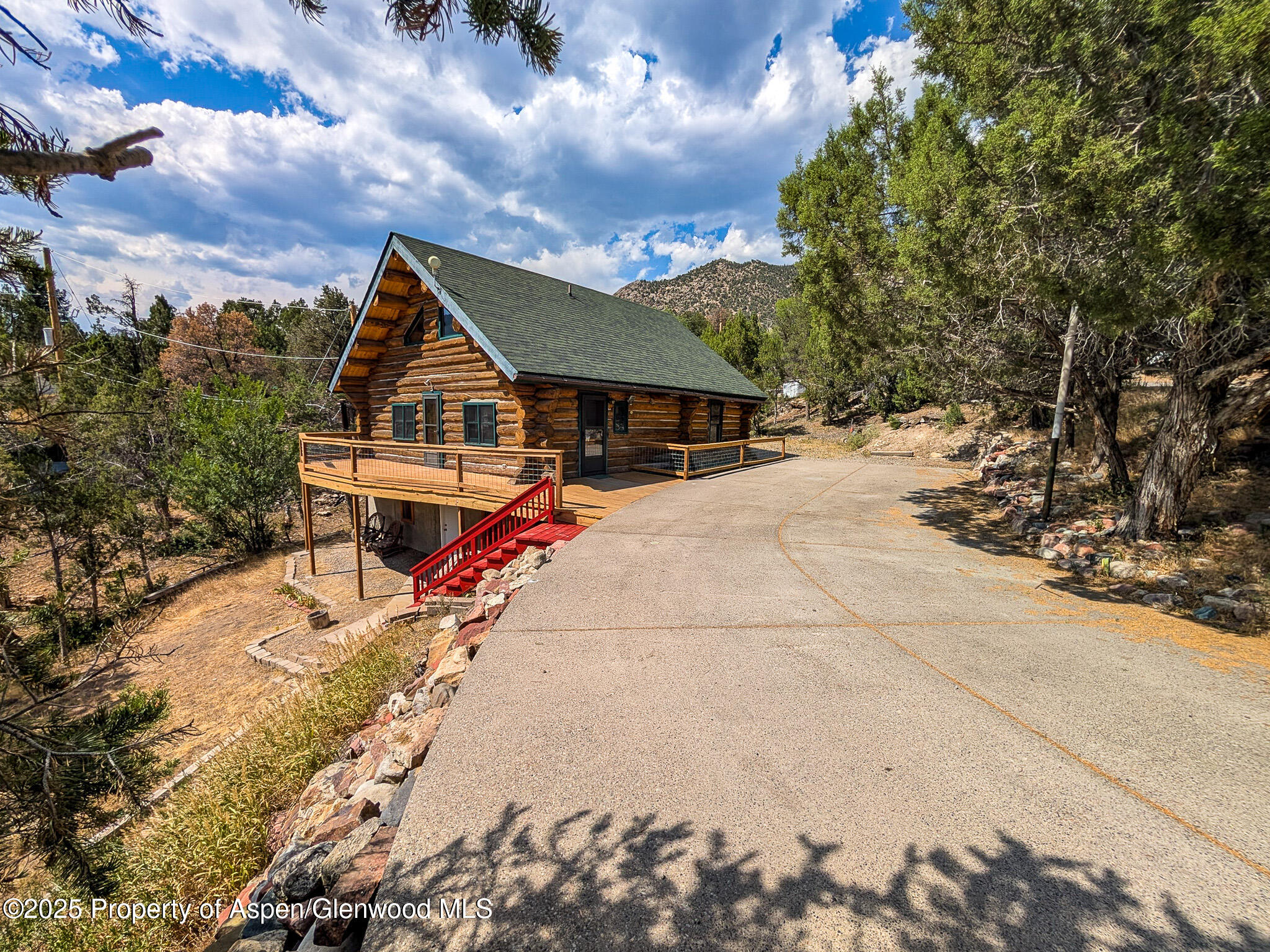 96 Apache Drive New Castle, CO 81647 - Photo 30 of 34 a view of the house with backyard and trees