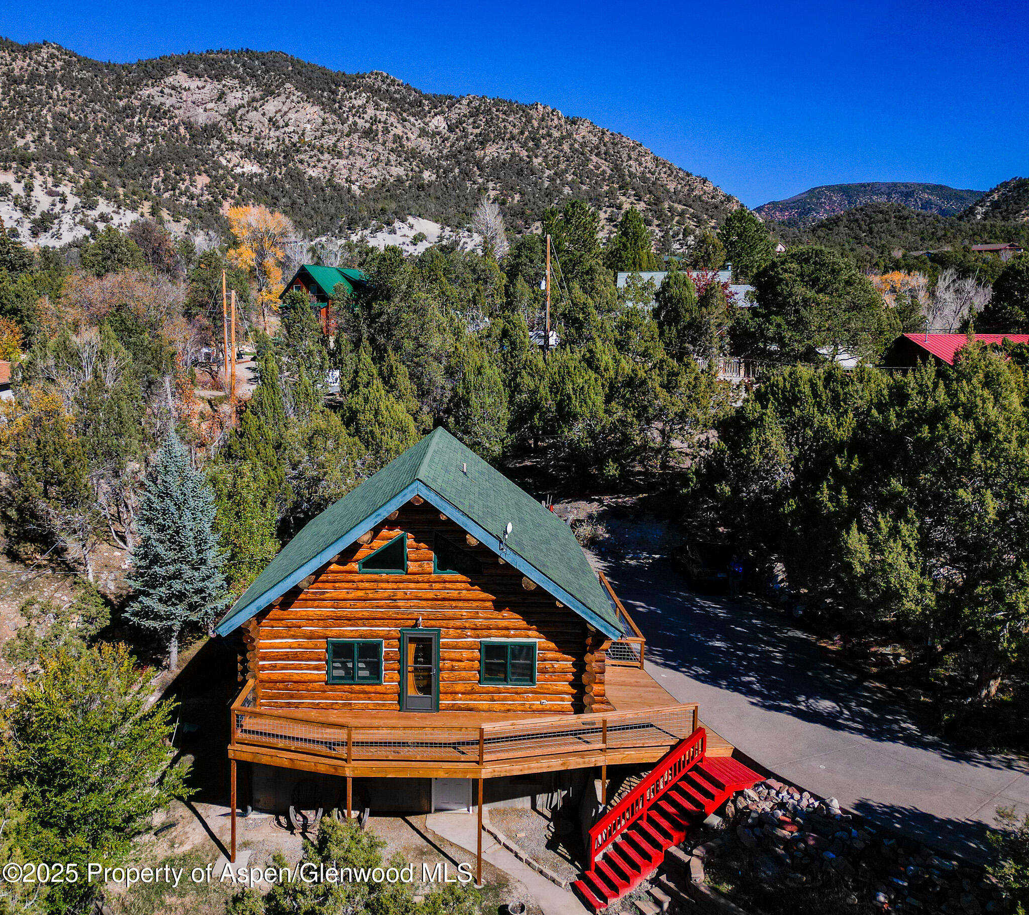 96 Apache Drive New Castle, CO 81647 - Photo 3 of 34 a view of a wooden house with a yard