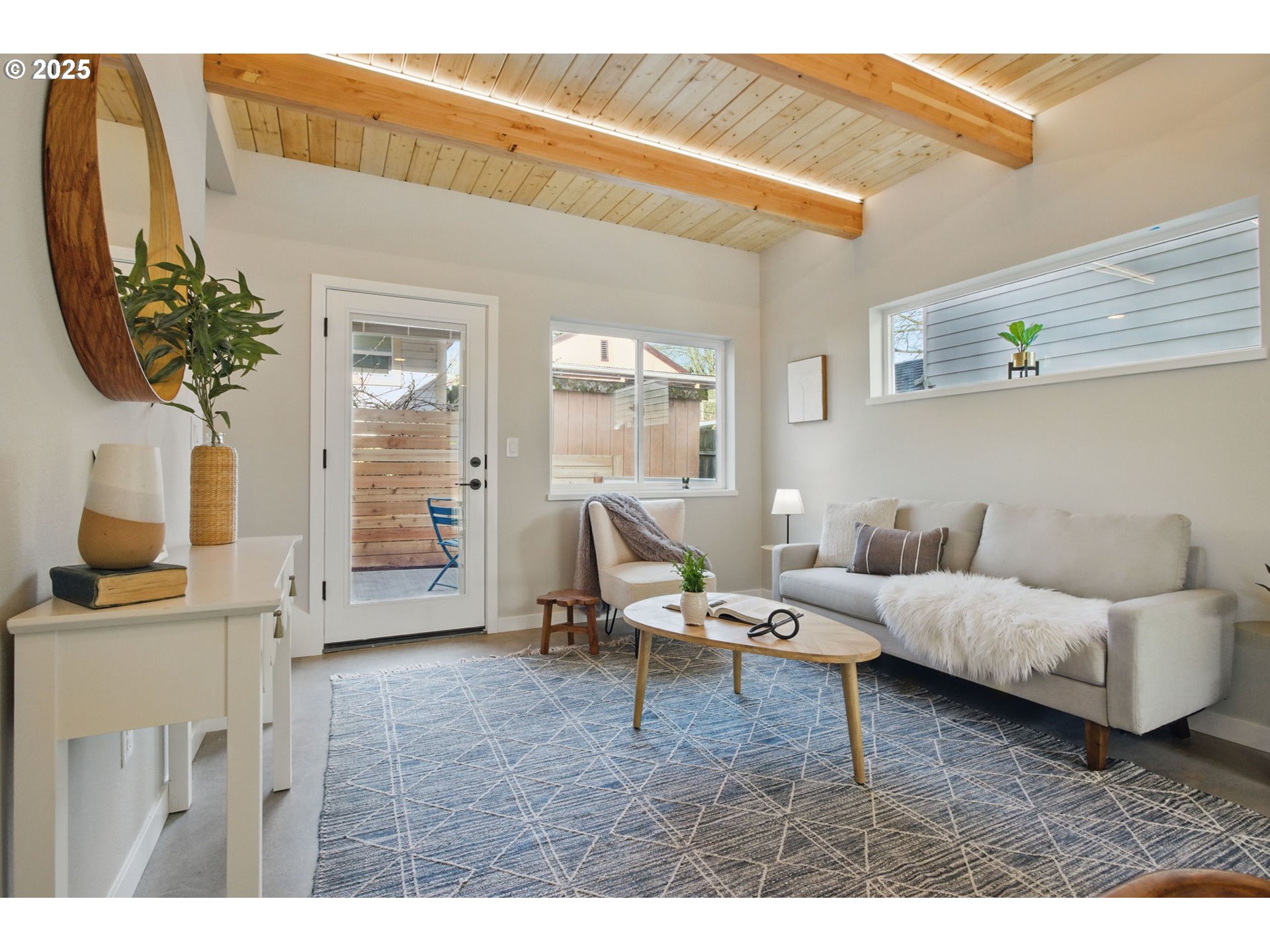 1123 Southeast Rhone Street, Unit B Portland, OR 97202 - Photo 14 of 30 a living room with furniture and wooden floor