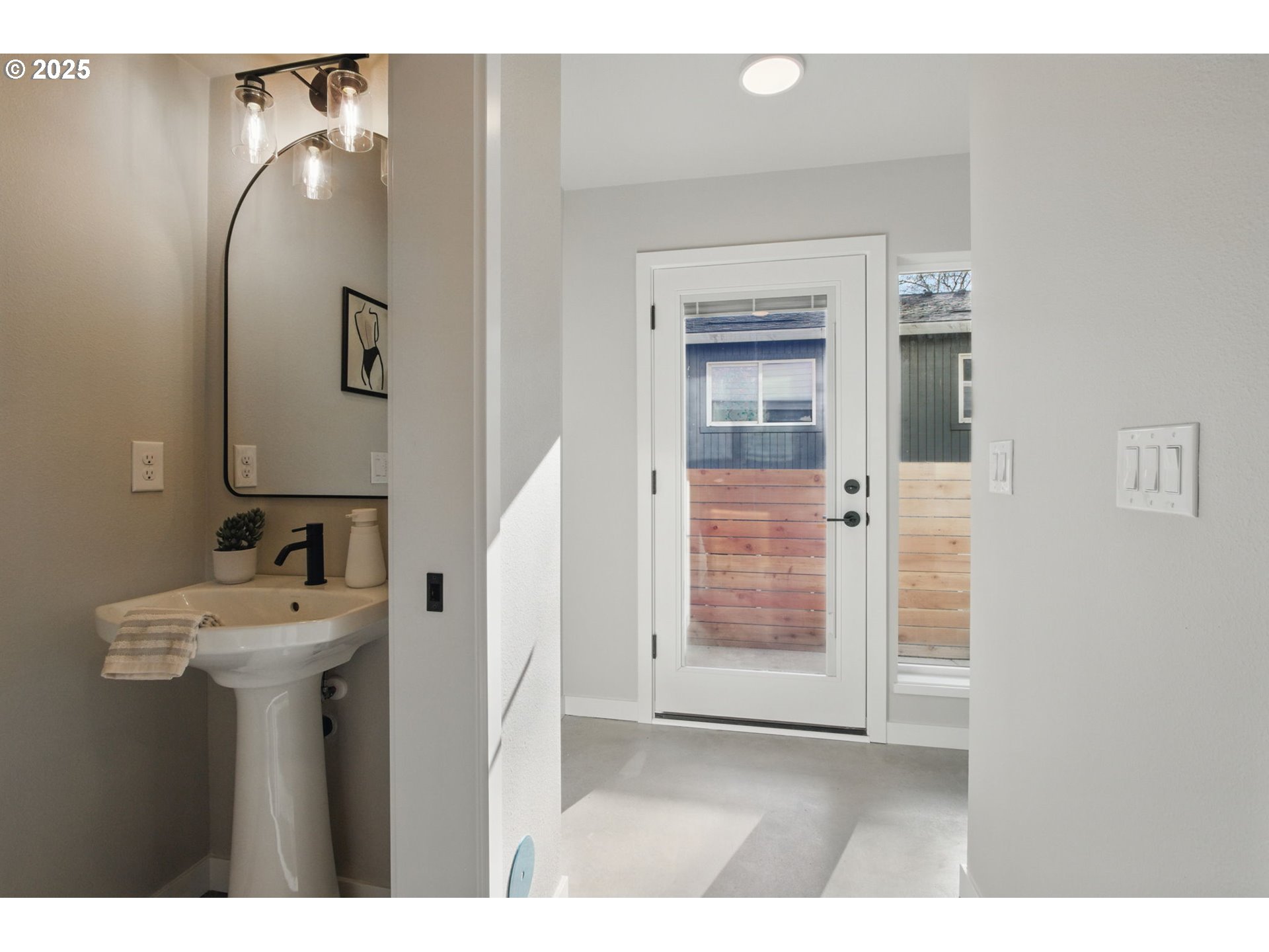 1123 Southeast Rhone Street, Unit B Portland, OR 97202 - Photo 18 of 30 a bathroom with a sink and mirror