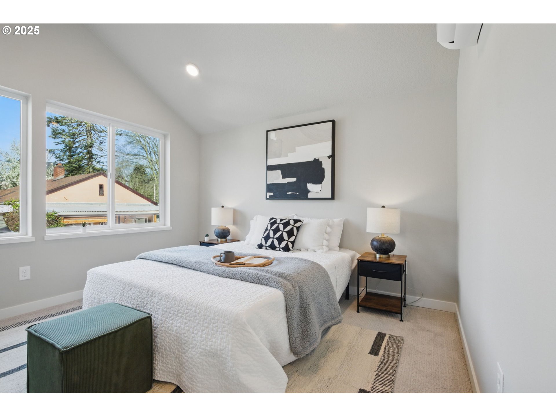 1123 Southeast Rhone Street, Unit B Portland, OR 97202 - Photo 27 of 30 a bedroom with a bed a mirror and a night stand