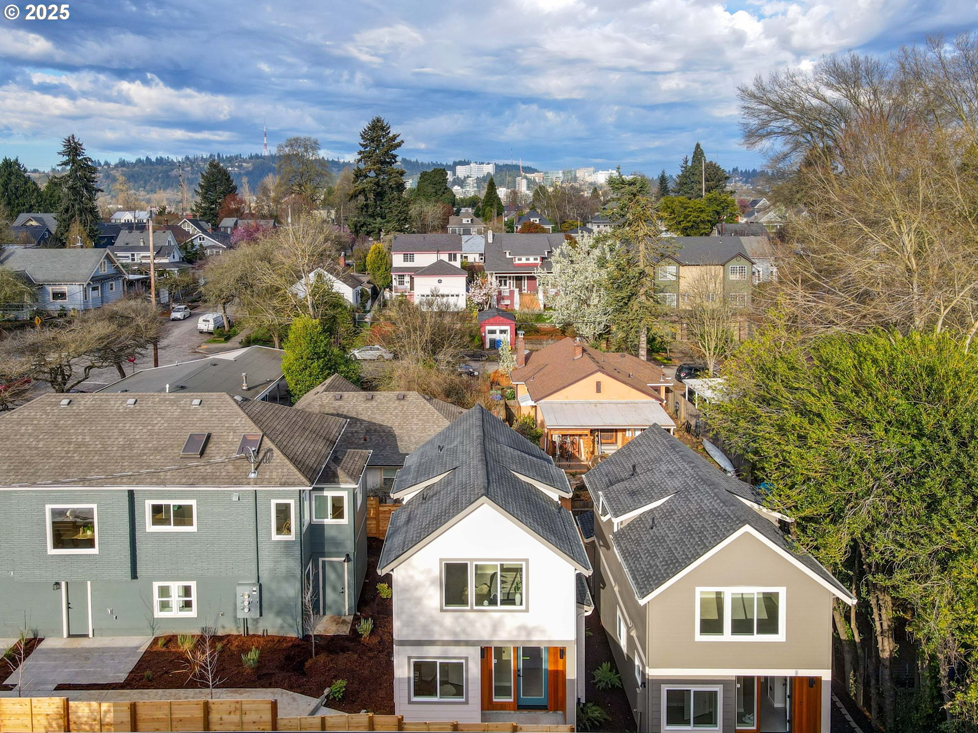 1123 Southeast Rhone Street, Unit B Portland, OR 97202 - Photo 4 of 30 a view of a city with tall buildings