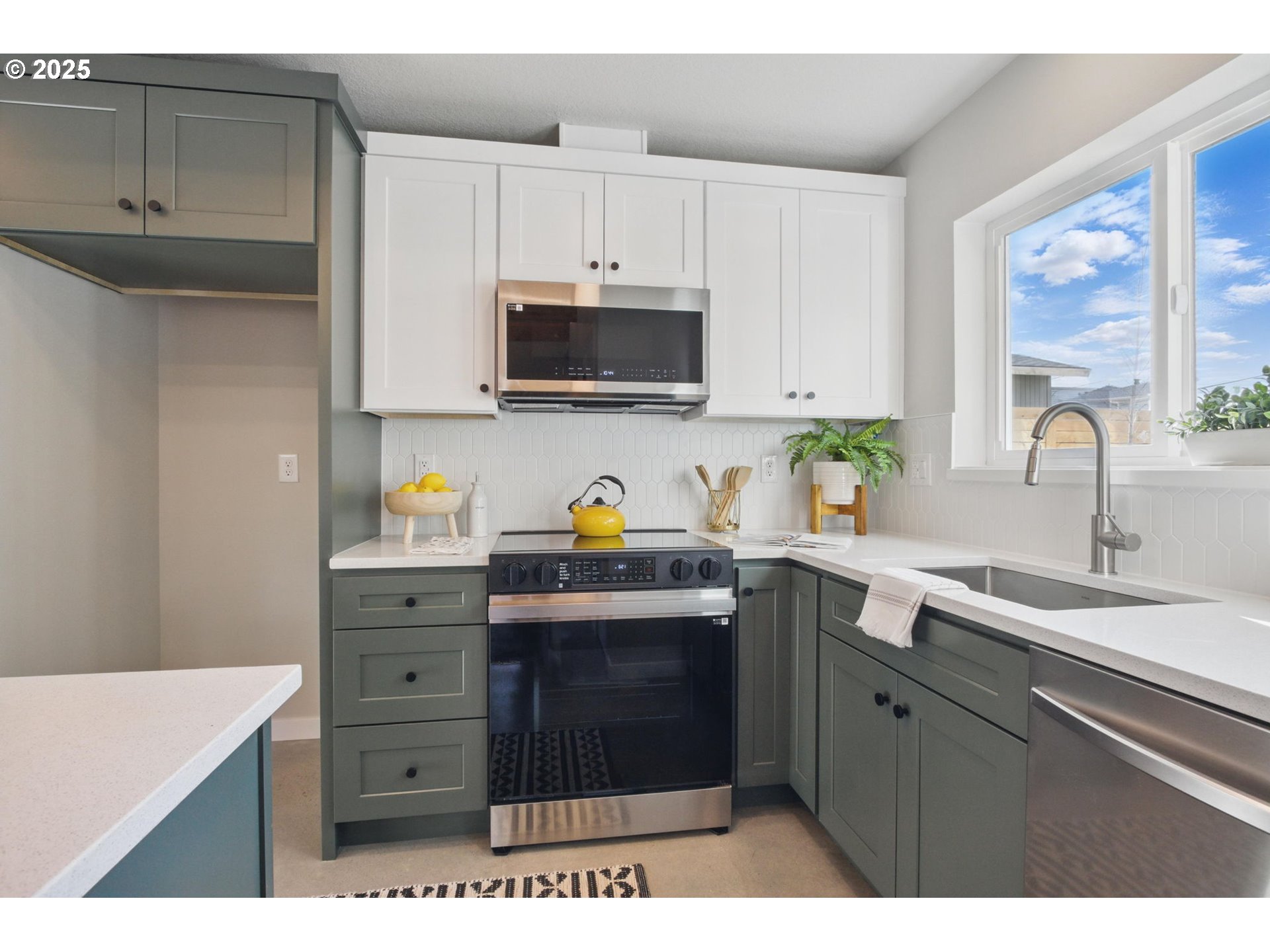 1123 Southeast Rhone Street, Unit B Portland, OR 97202 - Photo 9 of 30 a kitchen with stainless steel appliances granite countertop a sink stove and cabinets