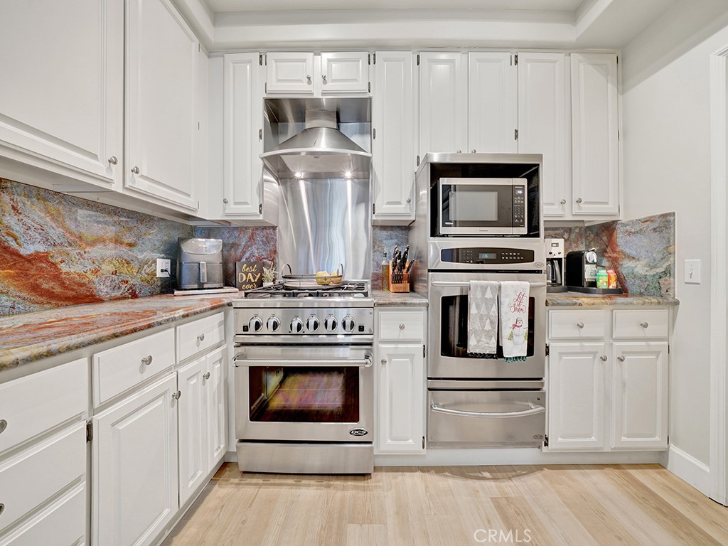 34102 Crystal Lantern Dana Point, CA 92629 - Photo 15 of 43 a kitchen with cabinets appliances and a counter space