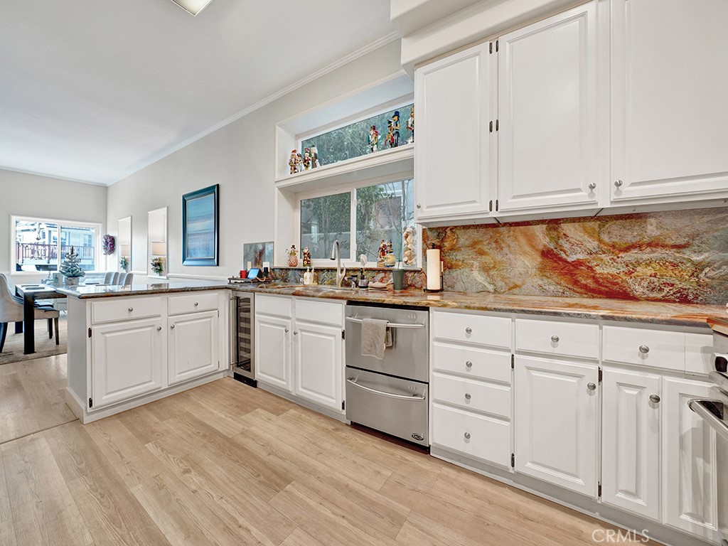 34102 Crystal Lantern Dana Point, CA 92629 - Photo 16 of 43 a kitchen with white cabinets and white appliances