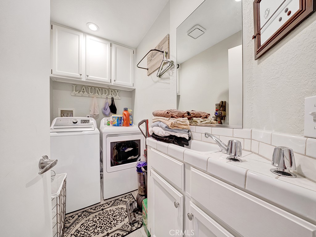 34102 Crystal Lantern Dana Point, CA 92629 - Photo 21 of 43 a utility room with sink dryer and washer