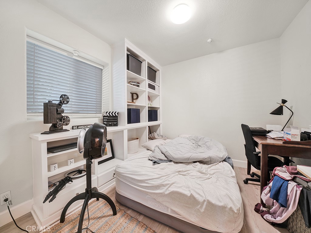 34102 Crystal Lantern Dana Point, CA 92629 - Photo 22 of 43 a bedroom with a bed and a chair