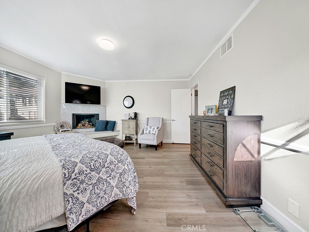 34102 Crystal Lantern Dana Point, CA 92629 - Photo 29 of 43 a bedroom with a bed a mirror and a flat tv screen on dresser