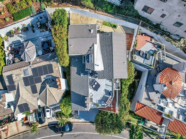 an aerial view of residential houses with outdoor space