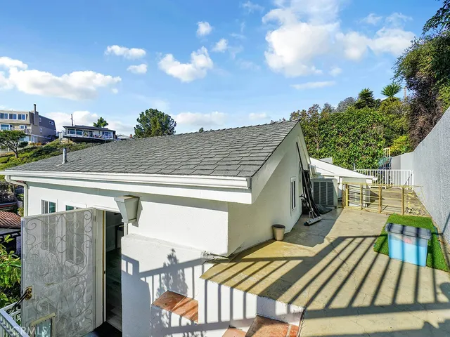 a view of a balcony with two chairs and a table