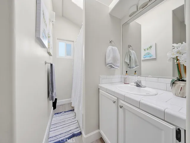 a en suite bathroom with a sink and a mirror