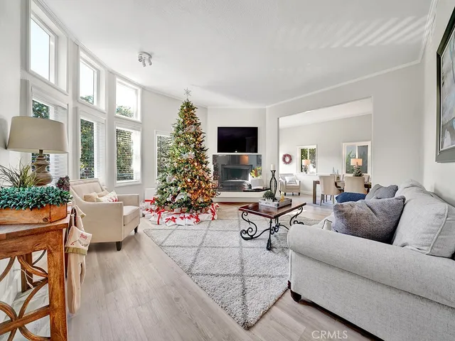 a living room with furniture and flowers