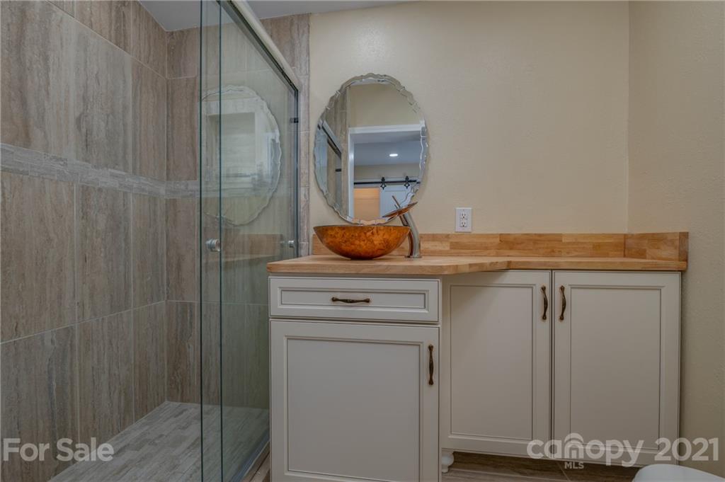 116 Riley Court Rutherfordton, NC 28139 - Photo 13 of 28 a bathroom with a granite countertop sink and vanity