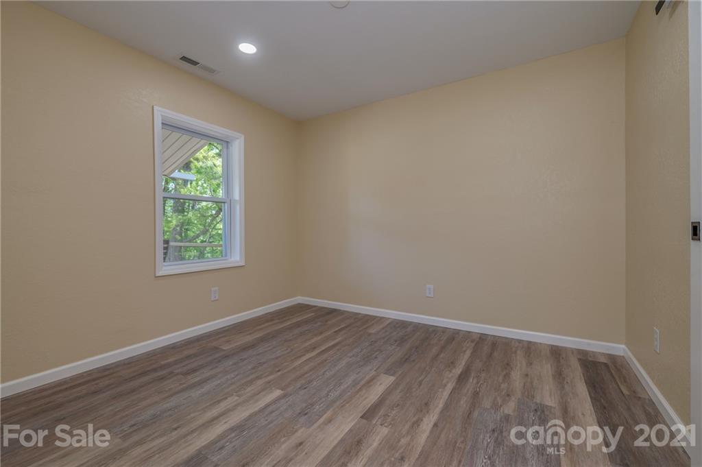116 Riley Court Rutherfordton, NC 28139 - Photo 16 of 28 wooden floor in an empty room with a window