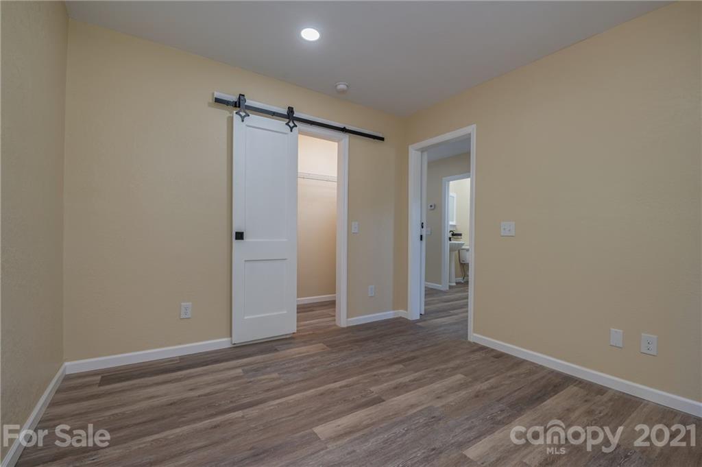 116 Riley Court Rutherfordton, NC 28139 - Photo 17 of 28 a view of an empty room with wooden floor