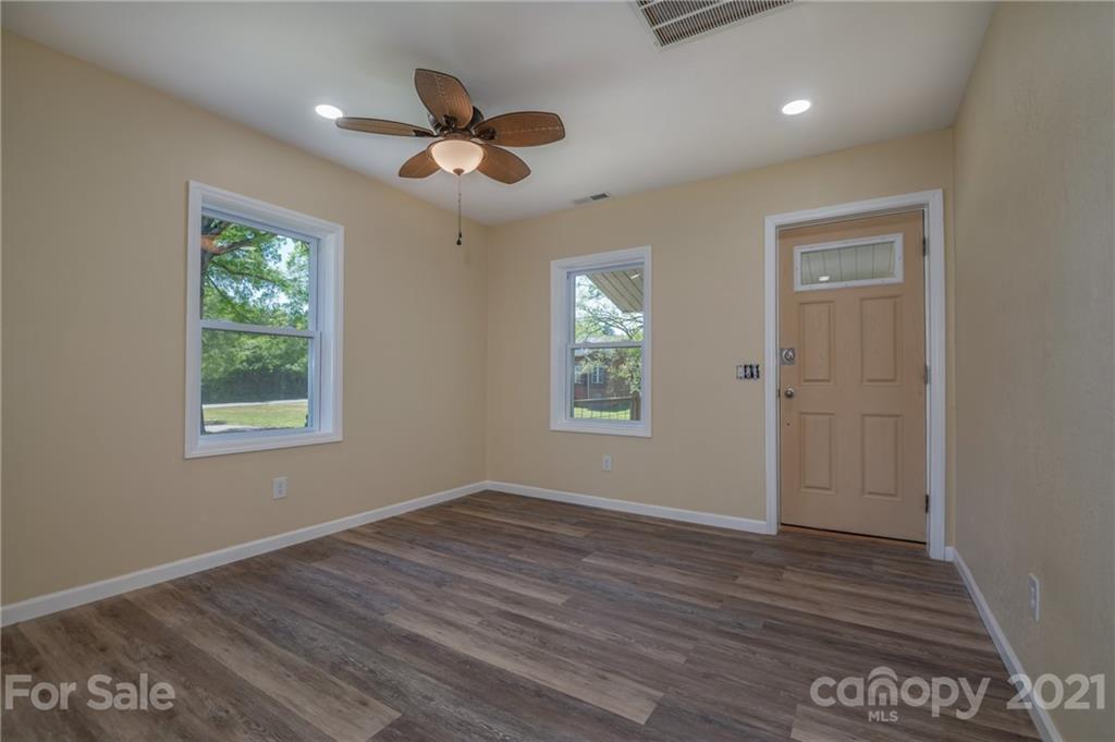 116 Riley Court Rutherfordton, NC 28139 - Photo 3 of 28 a view of an empty room with wooden floor and a window
