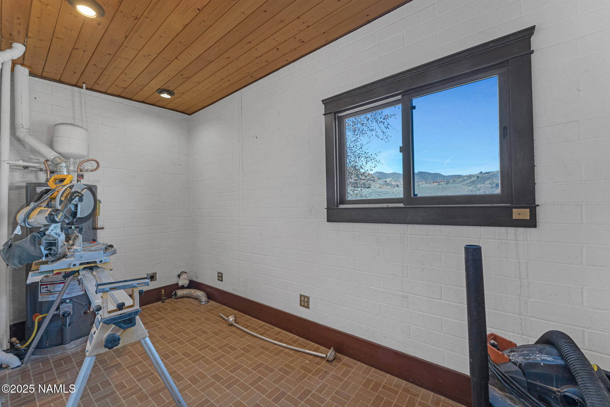 222 1st Avenue, Unit B Jerome, AZ 86331 - Photo 12 of 14 a room with gym equipment and a window
