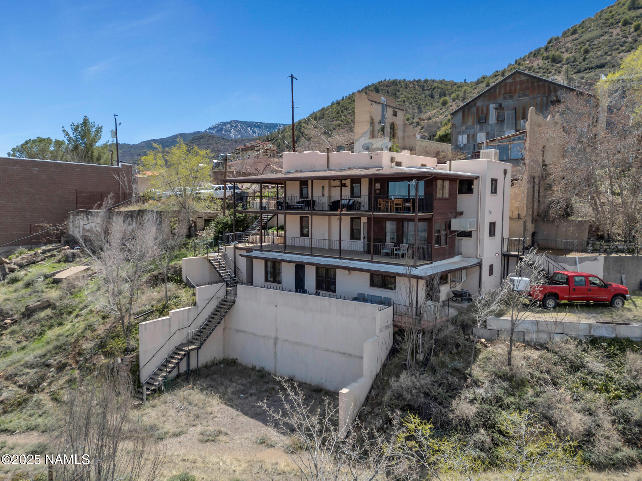 222 1st Avenue, Unit B Jerome, AZ 86331 - Photo 14 of 14 a view of a house with a yard and sitting area