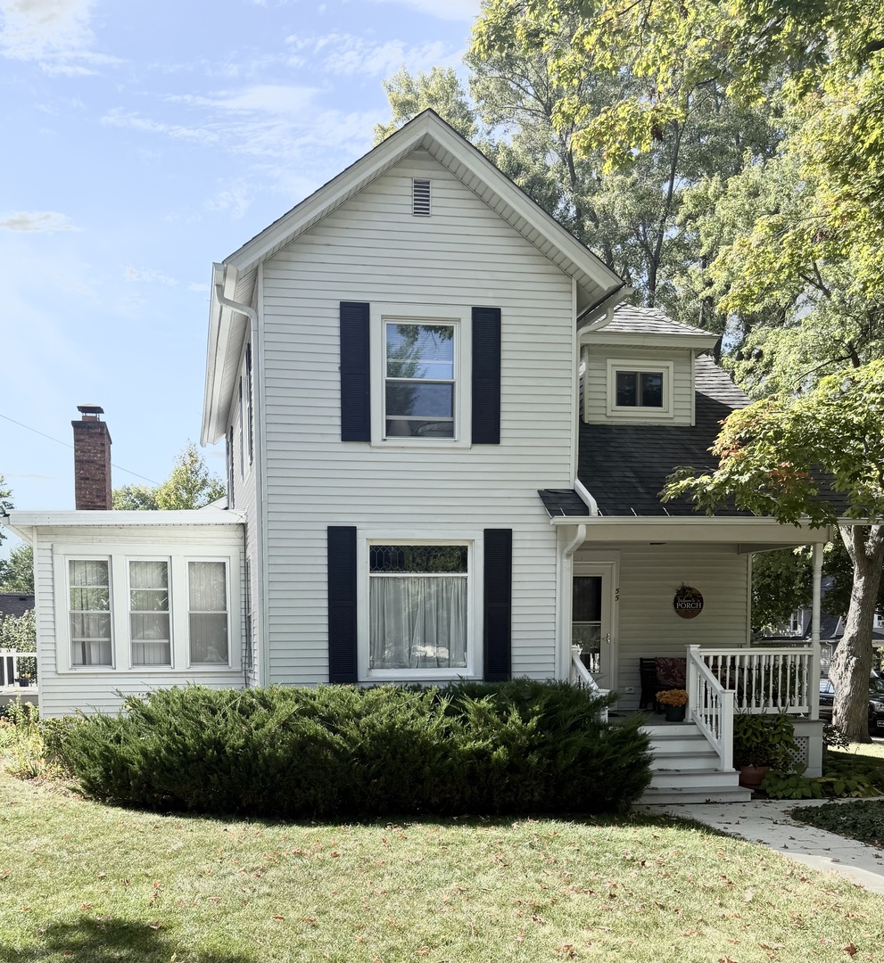 55 Garfield Street Oswego, IL 60543 - Photo 25 of 27 a front view of a house with a yard