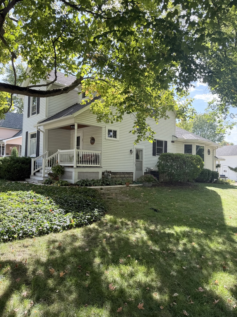 55 Garfield Street Oswego, IL 60543 - Photo 26 of 27 a front view of a house with a yard