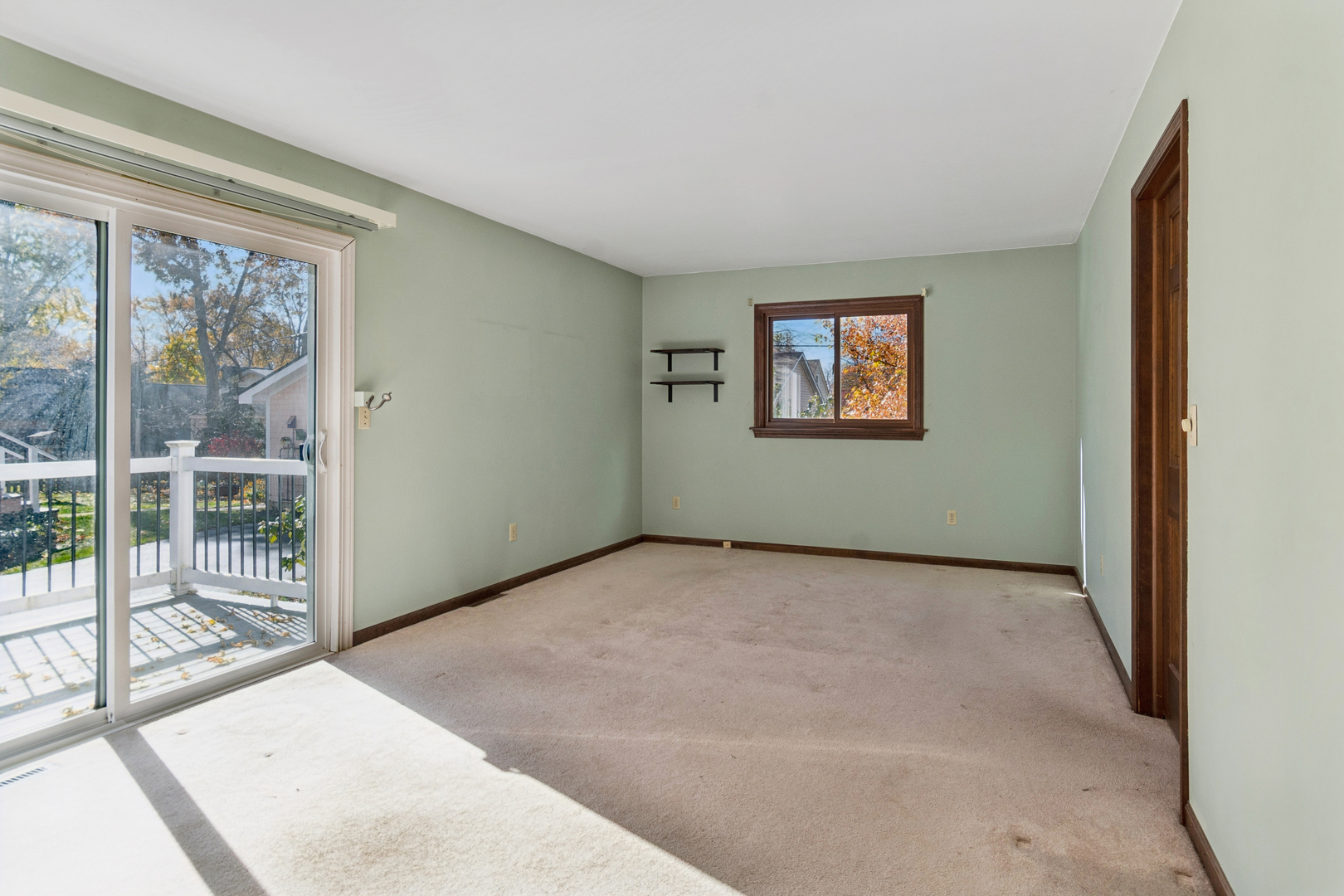 55 Garfield Street Oswego, IL 60543 - Photo 6 of 27 a view of an empty room with glass door