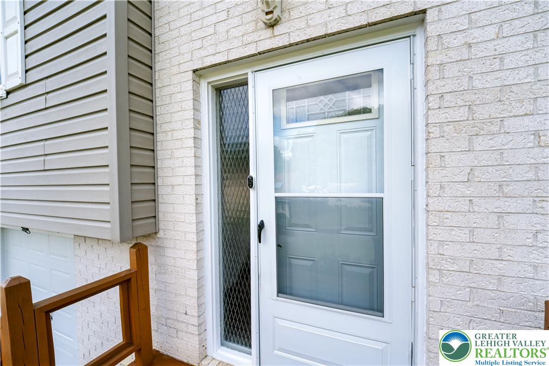 1764 Ritter Street Bethlehem, PA 18015 - Photo 7 of 29 White brick accents frame the secure storm door entrance of this multi-level home.