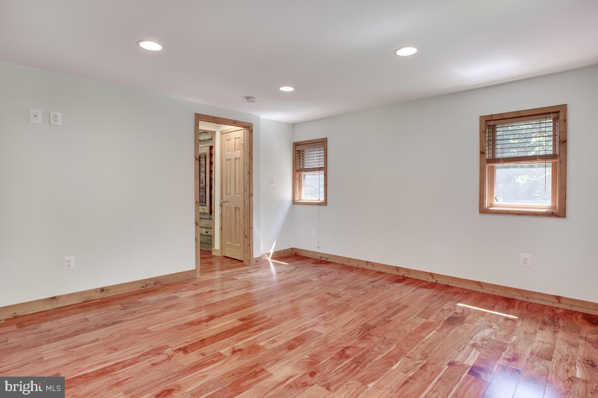 2359 Acacia Road Port Republic, MD 20676 - Photo 24 of 69 a view of an empty room with wooden floor and a window