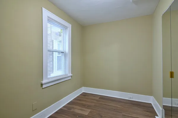 a view of a kitchen cabinets and wooden floor