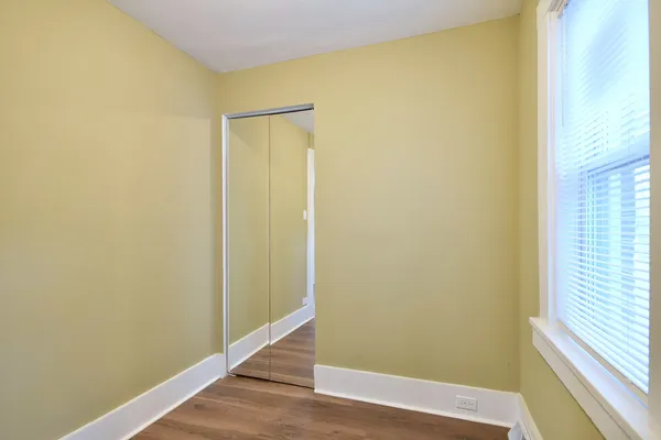 a view of empty room with windows
