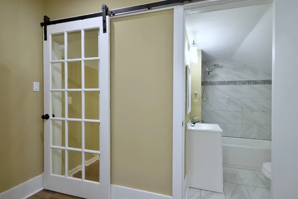 a bathroom with a sink shower and a bathtub