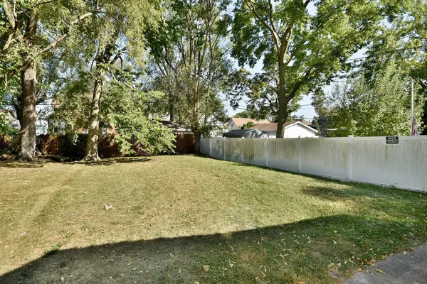 a house that has a tree in front of it