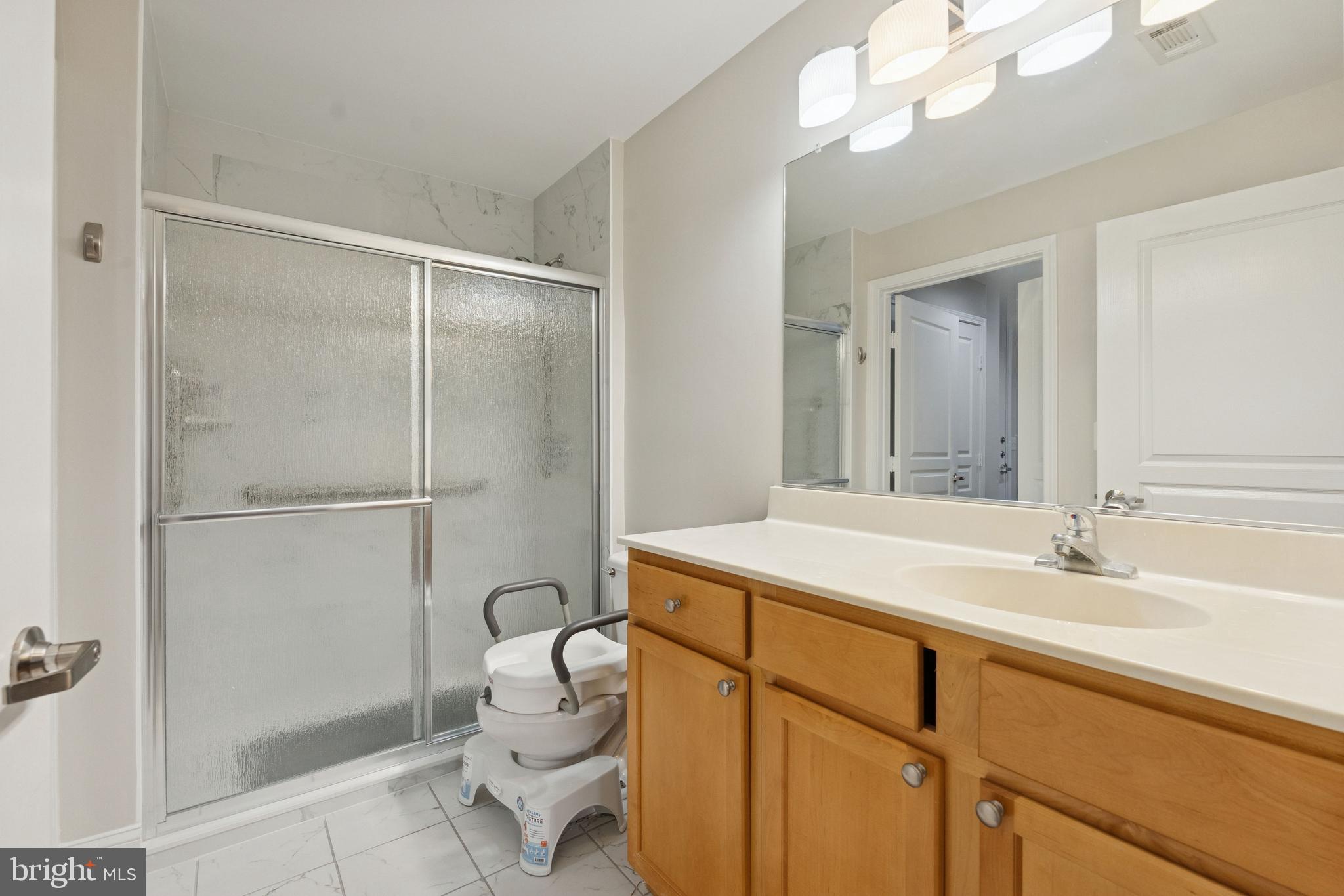 12000 Market Street, Unit 445 Reston, VA 20190 - Photo 15 of 51 Primary bath - remodeled in 2025