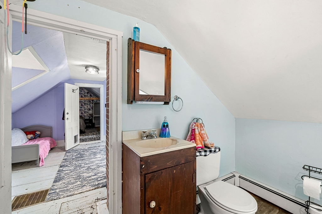 600 Main Street Ashby, MA 01431 - Photo 26 of 40 a bathroom with a sink mirror vanity and toilet