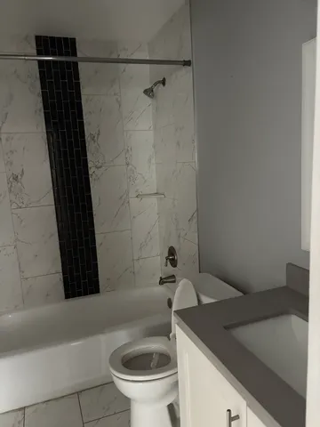 a bathroom with a sink and a toilet