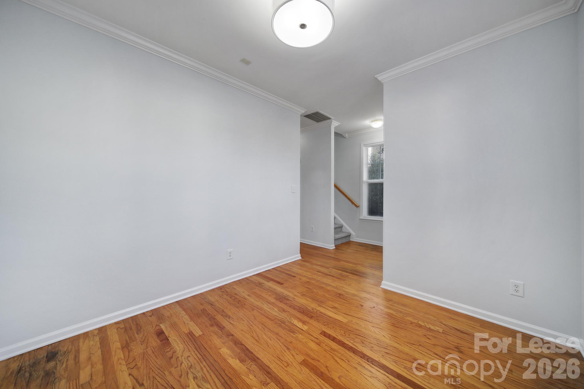 14844 Scothurst Lane Charlotte, NC 28277 - Photo 14 of 33 a view of empty room with wooden floor