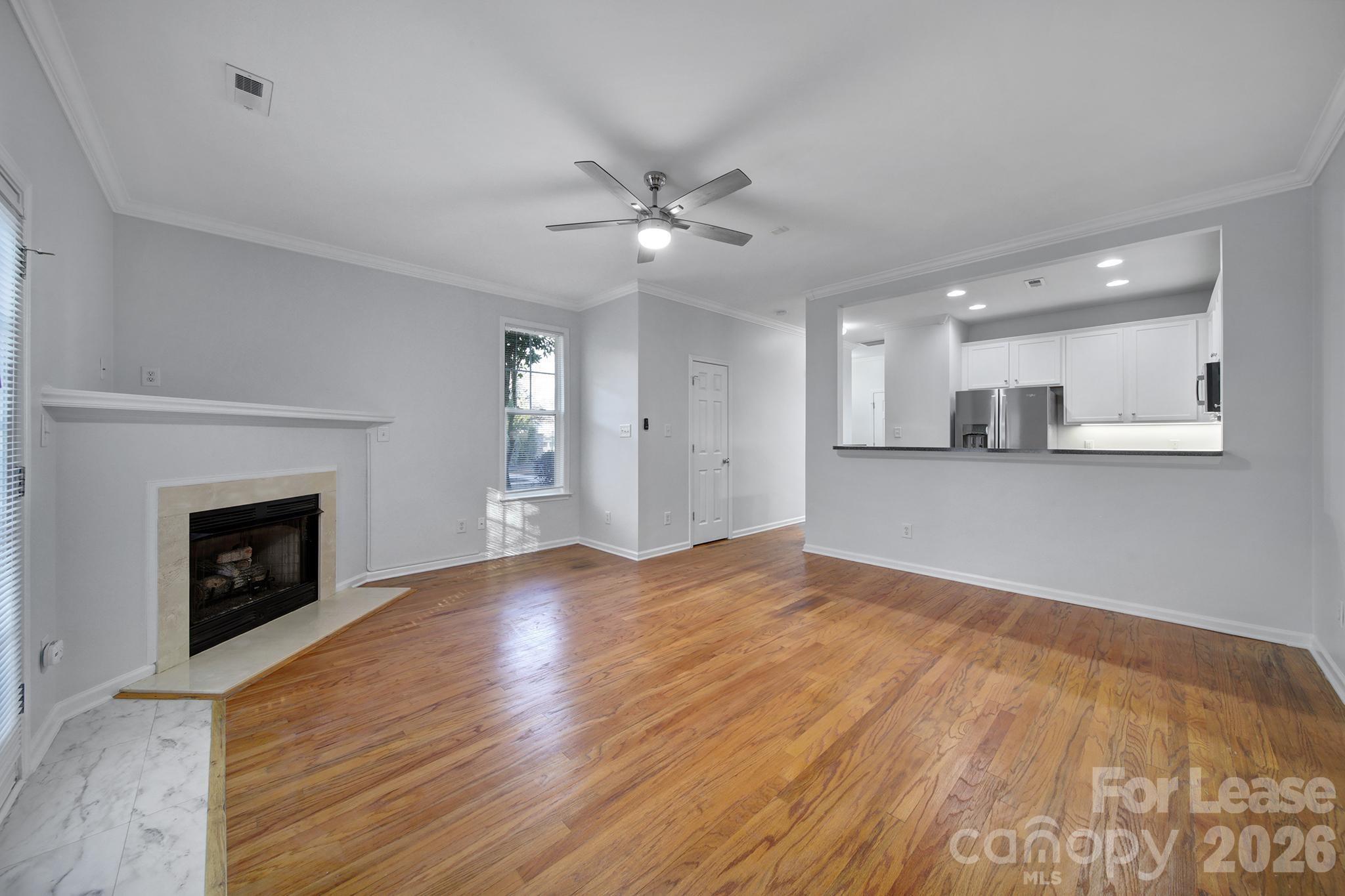 14844 Scothurst Lane Charlotte, NC 28277 - Photo 22 of 33 a view of a kitchen with a sink and a fireplace