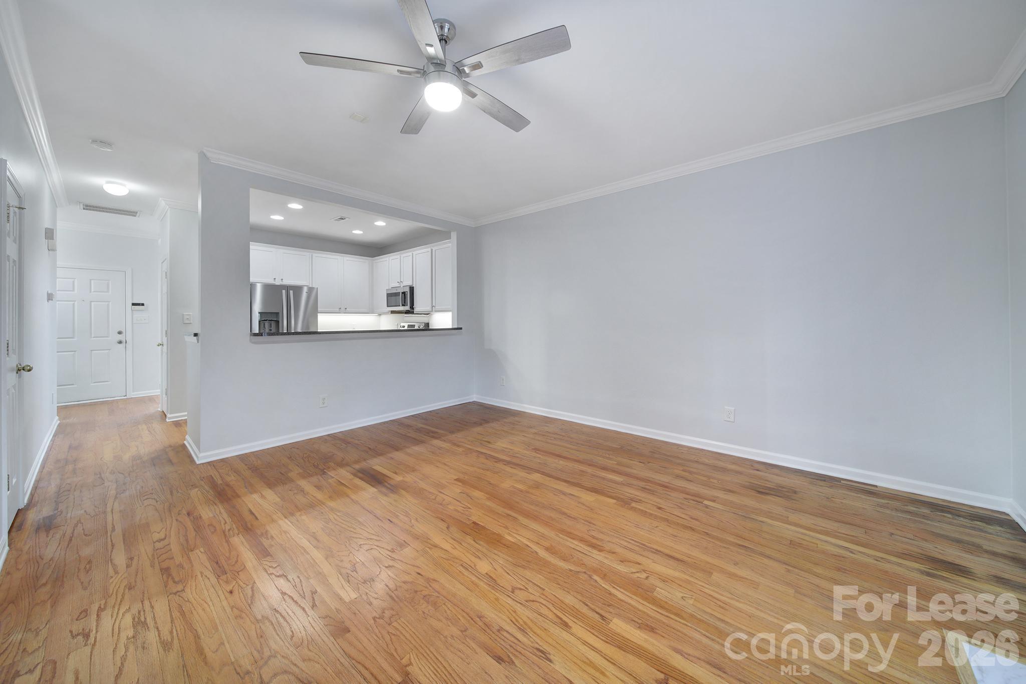 14844 Scothurst Lane Charlotte, NC 28277 - Photo 23 of 33 a view of a kitchen with wooden floor and a kitchen space